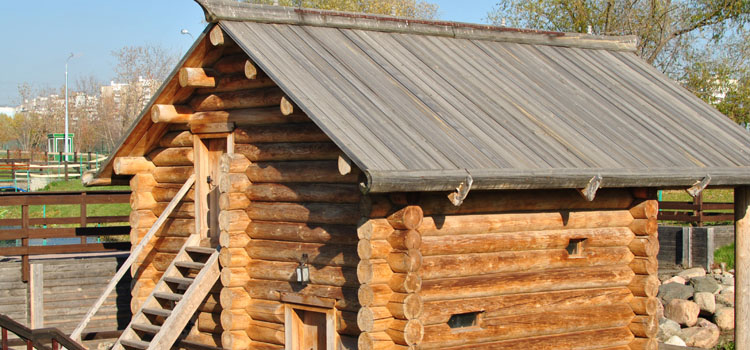 Traditional Russian wooden log house-room, with stairs